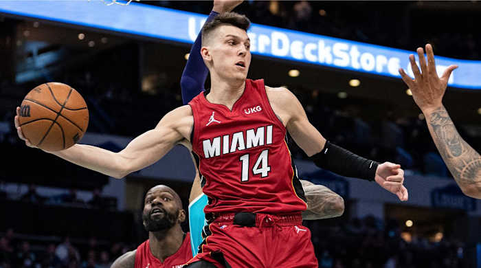 Miami Heat guard Tyler Herro (14) passes the ball during the second half of an NBA basketball game against the Charlotte Hornets in Charlotte, N.C., Saturday, Feb. 5, 2022.